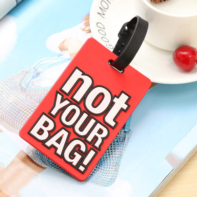 Lindas etiquetas de silicona para equipaje con el mensaje "Not Your Bag"