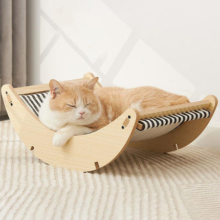 Cama mecedora de madera para gatos