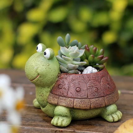 Bonita jardinera con forma de tortuga de dibujos animados para suculentas y cactus