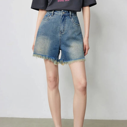 Short en jean taille haute à pompons pour femme