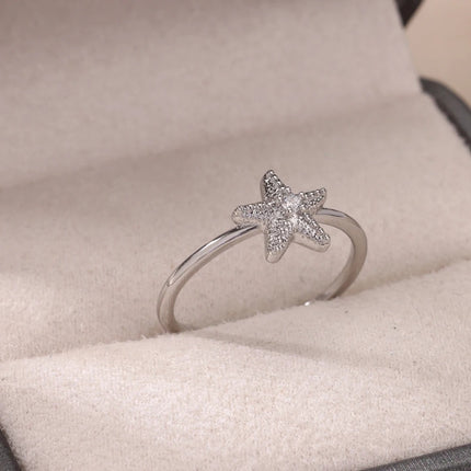 Anillo de estrella de mar con circonitas para mujer