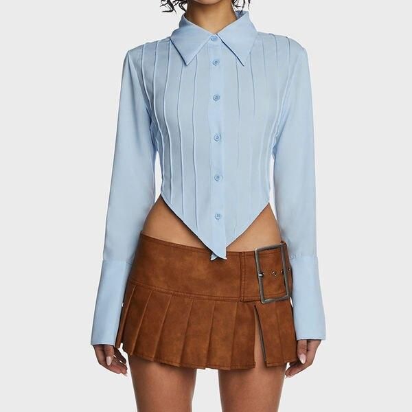 Blusa elegante azul con espalda con cordones y dobladillo en forma de V