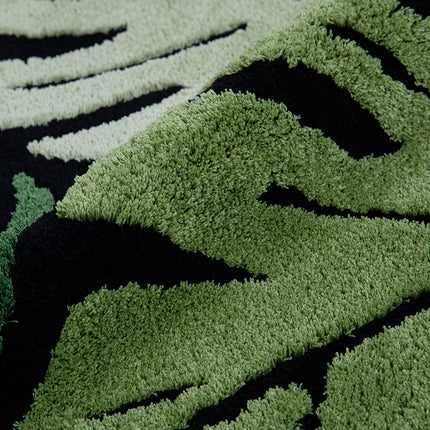 Tapis rond en peluche à motif de feuilles de Monstera vertes