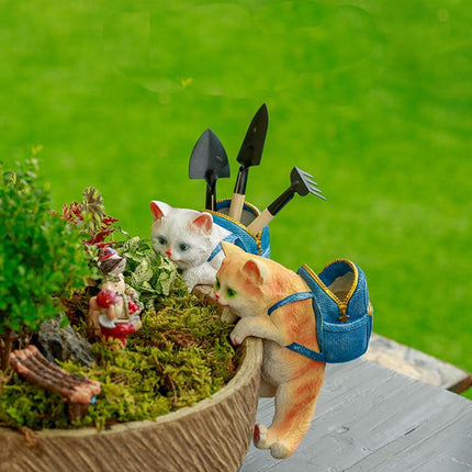 Estatua de jardín con forma de gato en forma de mochila