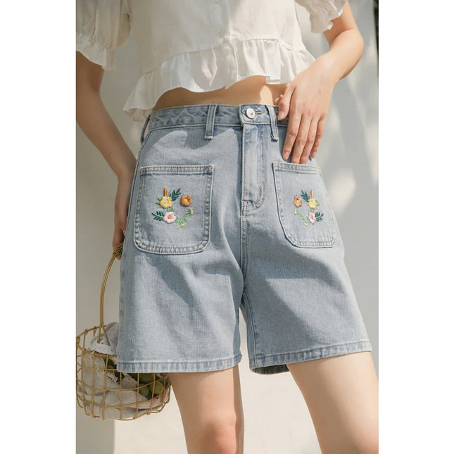 Shorts de mezclilla bordados en azul claro para mujer