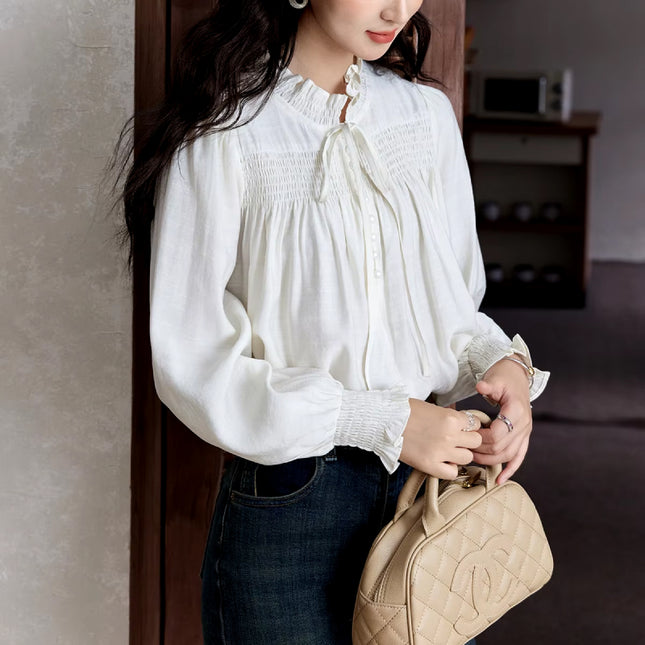 Blusa elegante de manga larga con cuello con volantes