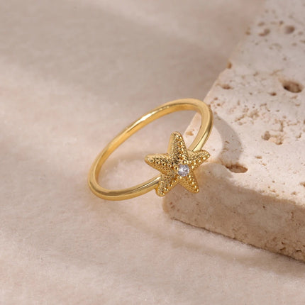 Anillo de estrella de mar con circonitas para mujer