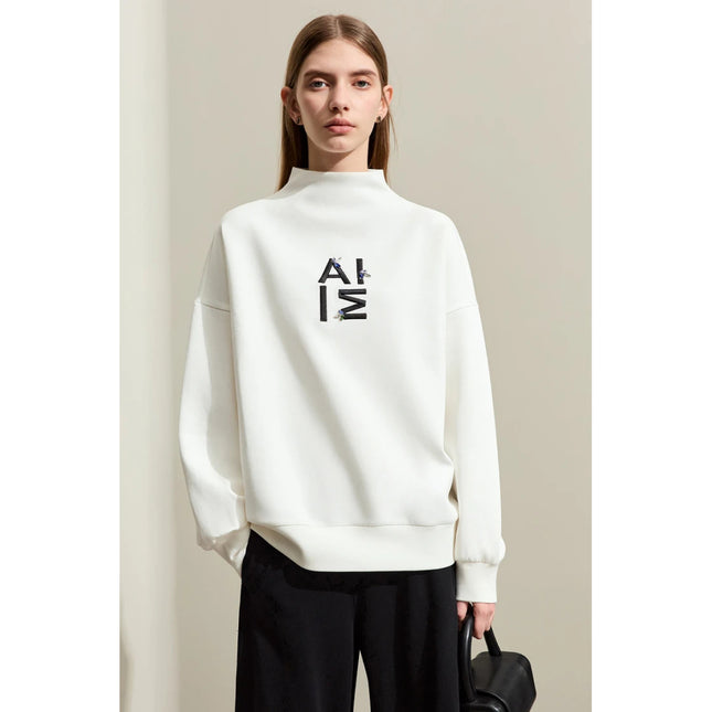 Sweat à capuche streetwear brodé minimaliste pour femme