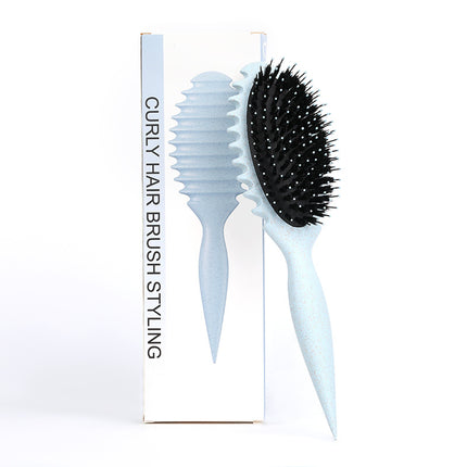 Brosse à cheveux démêlante en poils de sanglier pour définir les boucles