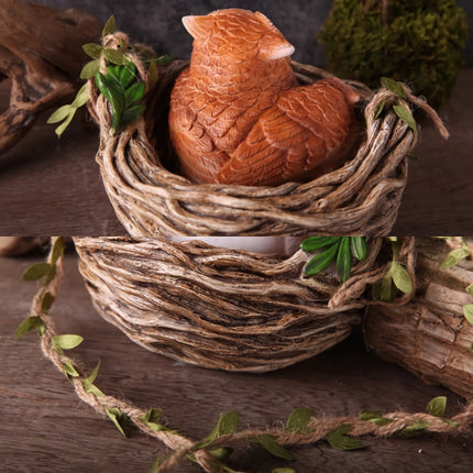 Sculpture en résine d'un hibou dans son nid