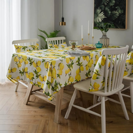 Mantel y funda de cojín de poliéster con estampado de limones en color amarillo