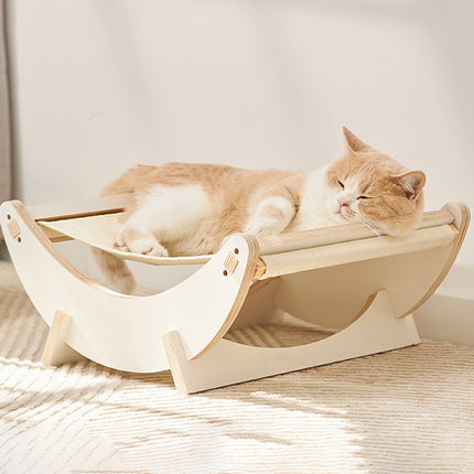 Cama mecedora de madera para gatos