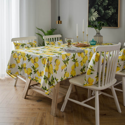 Mantel y funda de cojín de poliéster con estampado de limones en color amarillo