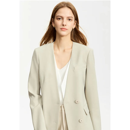 Elegante blazer con escote en V, cinturón y hombreras