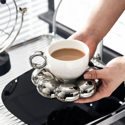 Tasse à café avec soucoupe et glaçage perlé au tournesol