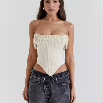 Haut corset chic sans bretelles avec pompons et perles