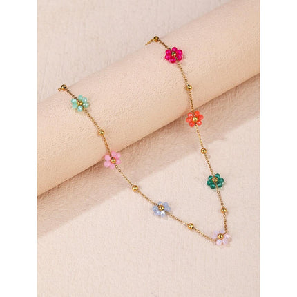 Pulsera de acero inoxidable con cuentas y flores de colores