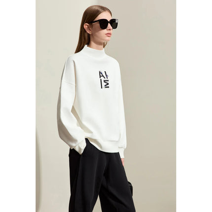 Sweat à capuche streetwear brodé minimaliste pour femme