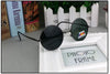 black-farme-and-green-lenses